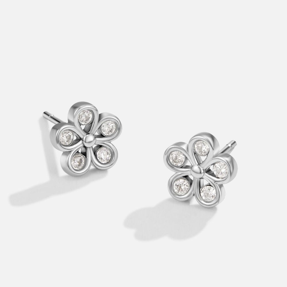 Five Petal Bloom Silver Earrings, pair of flower stud earrings on a plain white background