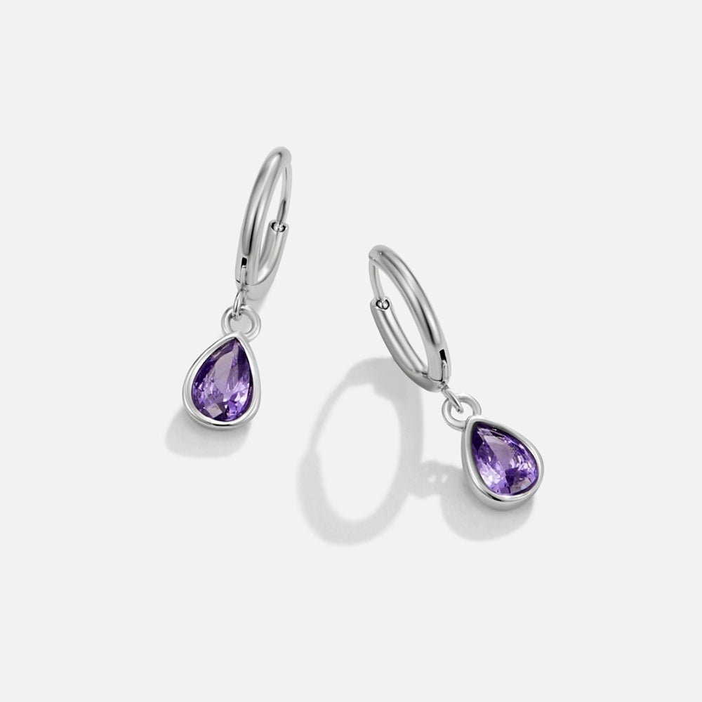 Silver Purple Teardrop Earrings, pair of silver hoop earrings with purple teardrop stones on white